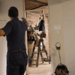 Electrician carrying out indoor electrical installation work