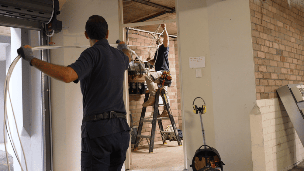 Electrician carrying out indoor electrical installation work