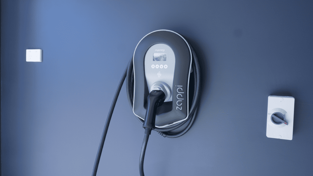 Residential EV charger installed on wall for electric vehicle charging