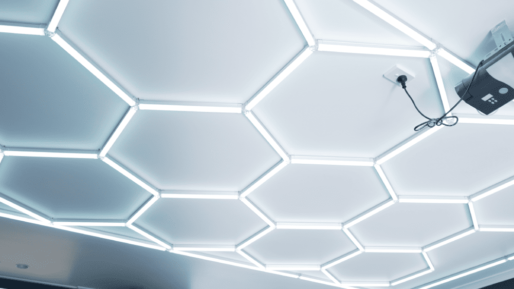 Hexagon LED ceiling lighting installed in garage or workshop area