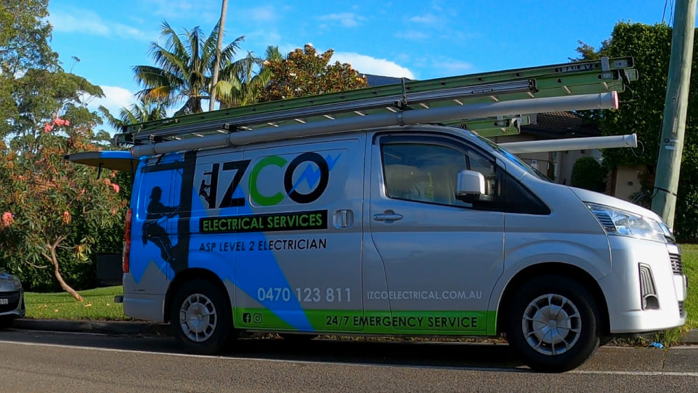 IZCO Electrical Level 2 electrician service van parked on residential street