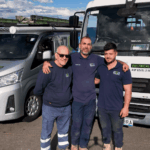 IZCO Electrical Level 2 electricians standing with service vehicles near the coast