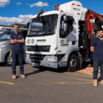 IZCO Electrical team standing with equipped service vehicles for electrical work