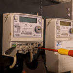 Close-up of electrical meter connection testing