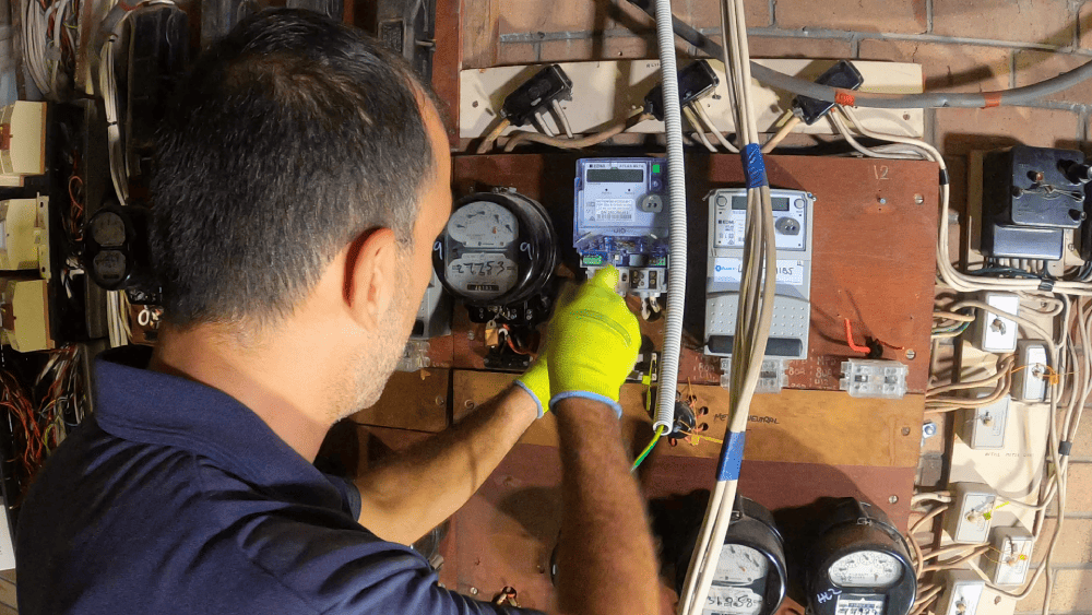 Electrician working on residential meter installation and wiring