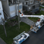 Level 2 electrician working from elevated platform on private power pole
